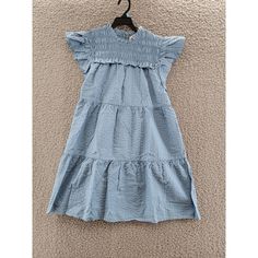 Sea Sevyn Pucker Smocked Dress Girls' 10y Blue Round Neck Cap Flutter Sleeves Sea Sevyn Pucker Smocked Dress Girls' 10y Blue Round Neck Cap Flutter Sleeves Retail $165.00 Elevate Your Little Girl's Summer And Spring Wardrobe With This Charming Sea Sevyn Pucker Smocked Dress. The Knee-Length A-Line Dress Features A Round Neckline And Short Cap Flutter Sleeves. It Comes With A Zipper Closure And Is Made Of A Blended Fabric Material That Is Machine Washable For Easy Care. The Dress Is In A Sol Blue Tiered Smocked Dress With Ruffles, Casual Cotton Smocked Dress With Flutter Sleeves, Blue Tiered Smocked Dress With Ruffle Hem, Blue Casual Cotton Smocked Dress, Casual Blue Cotton Smocked Dress, Blue Casual Smocked Dress With Ruffle Hem, Casual Blue Smocked Dress With Ruffles, Blue Summer Smocked Dress With Flutter Sleeves, Blue Smocked Dress With Flutter Sleeve For Summer