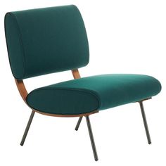 an upholstered green chair with metal legs