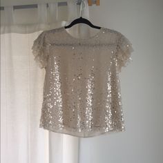 Brand New Anthropologie Champagne Sparkle Top. Size Xs. This Shirt Was A Part Of Their Fall 2020 Collection. It Was Only Worn For A Couple Hours For The First Half Of A Photo Shoot. It Has A Flutter Cap Sleeve And The Sparkles Are Sequins That Capture The Light But Aren’t “Metallic”. It Is Not See Through. Just Maybe Don’t Wear A Hot Pink Bra With It. Hot Pink Bra, Sparkle Top, Anthropologie Top, Pink Bra, Cap Sleeve, Cap Sleeves, Photo Shoot, A Photo, Hot Pink