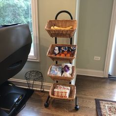 a three tiered basket with food in it