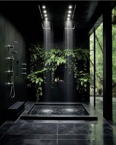 an indoor shower is shown with plants growing on the wall and in the middle of the room