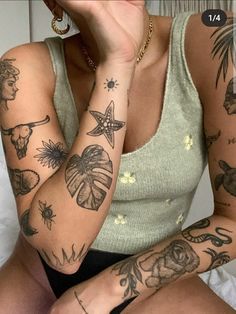 a woman with many tattoos on her arms