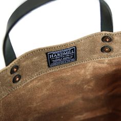 "Materials: - 22 oz. waxed canvas - 7 oz. leather - Copper rivets Features: - Easily folds - Inner leather base - Tote measurements: 13\" wide x 13\" tall x 5\" deep, with a 4\" strap drop length. - Spot clean with damp towel - Handcrafted in U.S.A. ** Grocery Tote now features a inner pocket, same as our Market Tote design.**" Grocery Tote Bag, Grocery Tote, Market Tote, Waxed Canvas, Canvas Tote, Bag Lady, Wax, Tote Bag, Purses And Bags