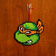 an ornament made to look like a cartoon character is hanging on a door