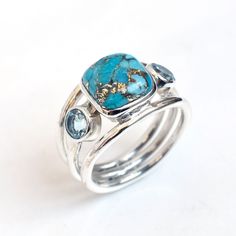 This Ring is handcrafted in Solid 925 Sterling Silver with Blue copper Turquoise & Blue Topaz gemstones, It is free from lead and nickel to prevent from any type of skin allergies. Metal/Material: 925 Silver SKU: U497 Gemstone: Blue Copper Turquoise Stone size: 12 mm, 5 mm Weight: 8.5 gram approx. Ring Sizes: 5 to 12 US. Please choose on Drop down, Stone Cut: Cab stone Stone Shape: Cushion, Round Stone Setting: Bezel Band Color: Silver Style: Statement Birthstone: December Stone Color: Blue Fini Unique Stackable Turquoise Ring, Adjustable Multi-stone Blue Rings, Adjustable Blue Multi-stone Rings, Unique Stackable Blue Rings, December Stone, Bezel Band, Skin Allergies, Les Chakras, Copper Turquoise