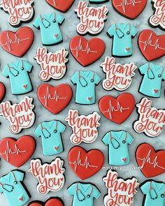 decorated cookies with thank you and nurse's shirts on them are displayed in a box