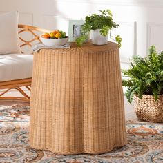 a wicker table with plants on top