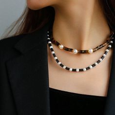 Upgrade your style with our timeless Black Onyx Pearl Necklace. Featuring smooth onyx beads and lustrous pearls, this necklace effortlessly combines classic beauty with modern sophistication. Metal: 18ct Recycled Gold Plated On Brass Gemstone: Black Onyx,Pearl Length: 410-460mm Weight: 32g Elegant Gemstone Beads Necklaces For Layering, Black Pearl Pendant Beaded Necklace, Black Beaded Pearl Necklaces With Pearl Pendant, Classic Black Pearl Chain Necklace, Elegant Black Beaded Necklace With Pearl Charm, Elegant Black Beaded Pearl Necklace, Black Beaded Necklace With Pearl Pendant, Black Beaded Necklaces With Pearl Pendant, Classic Black Necklace With Pearl Pendant