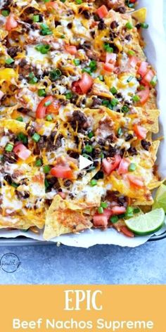 a casserole dish filled with beef nachos and cheese