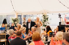 a group of people that are standing in front of a tent