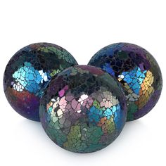 three shiny balls with different patterns on them