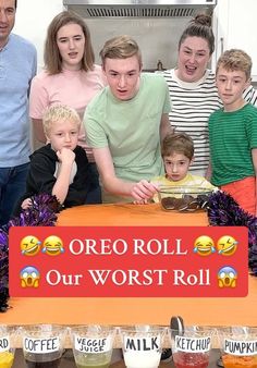 a group of people standing in front of a sign that says oreo roll our worst roll