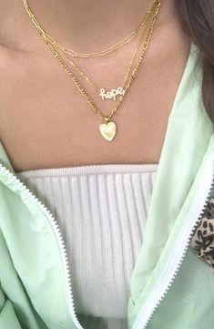 A shiny heart dangles sweetly from this gold-plated necklace with a shimmering figaro chain. The pendant can be removed whenever you want a minimalist look. Figaro Chain With Pendant, Trendy Gold Charm Necklaces, Trendy Gold Charm Necklaces For Valentine's Day, Trendy Gold Heart Necklace, Trendy Gold Necklaces For Valentine's Day, Trendy Gold Heart Pendant Necklace, Gold Heart Pendant Necklace Trendy, Trendy Gold Necklace For Valentine's Day, Trendy Gold Heart Charm Necklaces