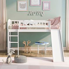 a child's bedroom with a white bunk bed