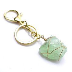 Product Description:Introducing our exquisite Gold-Plated Natural Crystal Raw Stone Keychain, a high-quality accessory that combines the allure of natural crystals with the elegance of gold. Each keychain features a 100% natural crystal adorned with a luxurious gold-plated finish, resulting in a captivating blend of beauty and sophistication. With dimensions ranging from 45-65mm and weighing approximately 0.05kg, our keychains offer a perfect balance of portability and opulent aesthetics.How to Gold Metal Keychain For Gift, Gold Metal Keychain Perfect For Gifts, Stone Keychain, Crystal Keychain, Rainbow Fluorite, Energy Crystals, Spiritual Jewelry, Raw Stone, Natural Crystals