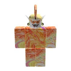 an ornament made to look like a cube with a demon on it's head