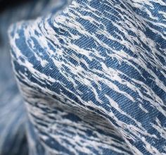 a close up view of a blue tie with white lines on it's side