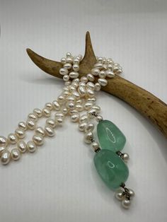 Vintage white Pearl Green Fluorite Larriet Choker  24 inches long ties in front  Thank you for supporting a small veteran owned business. All jewelry is shipped free within the US in a stylish gift box White Teardrop Lariat Necklace For Gift, Adjustable Single Strand Lariat Necklace As Gift, Adjustable White Lariat Necklace For Anniversary, White Lariat Jewelry As A Gift, White Single Strand Lariat Necklace For Gift, Handmade White Lariat Necklace As Gift, Green Pearl Necklace With Pearl Chain, Green And White Pearls Necklace, Luxury Green Pearl Chain Necklace