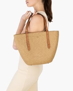 Eureka is a word that is defined as a cry of satisfaction meaning, “I found it!” This design’s beauty is in its simplicity: a timeless mid-size Squishee® straw tote with magnetic snap closure and leather trim. The body is unlined, revealing the perfect craftsmanship of row-on-row stitched braid. A canvas zip pouch clips in or out, and is convenient to secure valuables. Other features include adjustable handles and protective bottom feet. Squishee® is a man-made fabric incorporating rPET from rec Elegant Straw Tote Bag For On-the-go, Rectangular Tan Bags For On-the-go, Natural Color Satchel Shoulder Bag For On-the-go, Natural Satchel Straw Bag For On-the-go, Classic Rectangular Straw Bag For Everyday Use, Classic Straw Tote Bag For Everyday Use, Elegant Everyday Satchel Straw Bag, Classic Straw Bag With Leather Handles For Travel, Classic Shoulder Bag With Braided Handles In Natural Color