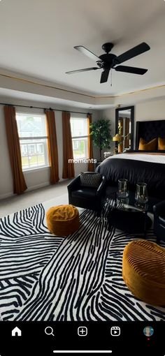 a bedroom with zebra print carpet and black furniture