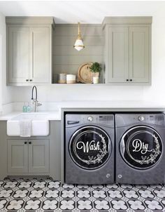 a washer and dryer sitting in a kitchen next to a sink with the words wash dry written on it