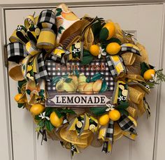 a lemonade wreath hanging on the front door