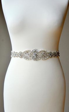 "Wedding Belt, Bridal Belt, Bridesmaid Belt, Bridesmaid Belt, Crystal Rhinestone Pearls Dress Sash Ready to ship Sophisticated and elegant bridal belt. This is unique luzury bridal belt with large rhinestone crystal applique. Fully encrusted with silver large crystals , rhinestones and pearls attached to satin ribbon. It will look great with any color dress, being either white, diamond, ivory, or antique. Looks great in the front , or on the side ! Made of - lovely stunning design applique decor Dress Sash Belt, Wedding Dress Sash Belt, Sash Wedding Dress, Belt Wedding Dress, Bridesmaid Sash, Bridal Sash Belt, Wedding Dress Sash, Wedding Dress Belt, Rustic Wedding Dresses