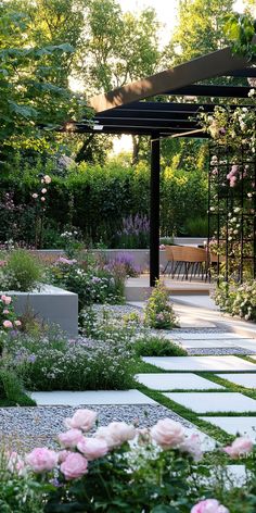 A stunning contemporary garden design with lush greenery, beautiful pink and lavender flowers, a pergola, and modern paving stones creating a serene outdoor sanctuary. Museum Garden Design, Modern Low Maintenance Garden, Modern Garden Design Luxury Backyards, Farmhouse Garden Landscaping, Urban Oasis Backyard, Landscaping Techniques, Kitchen Garden Ideas, Futuristic Materials, Modern Japanese Garden