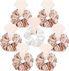 six scrunffle hair ties in pink and white with diamond shapes on each side