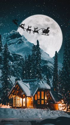 a house with santa's sleigh flying over it in front of a full moon