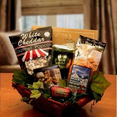 a basket filled with food and snacks on top of a table