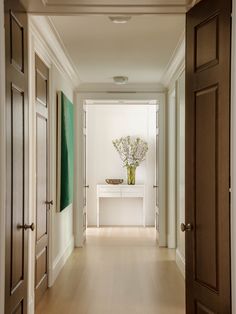 the hallway is clean and ready for us to use as an entrance way in this home