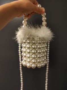 Elegant White Bags With Pearl Chain, Glamorous Pearl Evening Bag For Wedding, Glamorous Pearl Clutch With Pearl Handle, White Pearl Evening Bag For Party, Pearl White Pearl Evening Bag, Pearl Evening Bag With Pearl Handle, Pearl White Pearl Evening Bag For Events, Cream Pearl Evening Bag For Party, Glamorous White Evening Bag For Wedding