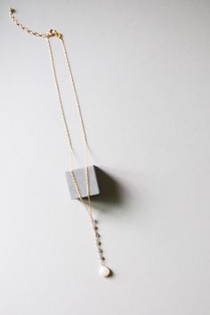 "Necklace is part of our Yoga pendant collection and are designed for total simplicity. - Y pendant style - Milky white chalcedony with faceted labradorite mini gems - 18\" length with an extender so it but can be worn up to 2 inches longer (up to a 20\"). Y pendant drop itself is 4\" long - Made of 14k gold plated fine Italian sterling silver and features - Spring ring clasp Our unique gold plating technique makes our gold plated jewelry tarnish resistant. These necklaces are great gifts and ar Yoga Pendant, Necklace Minimalist Jewelry, Minimalist Necklace Gold, Yoga Necklace, Nyc Studio, Chalcedony Stone, Y Necklace, Gemstone Jewelry Handmade, Best Jewelry