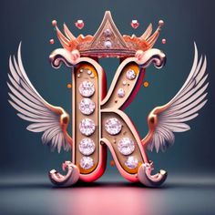 the letter k is surrounded by angel wings and jewels, with a crown on top