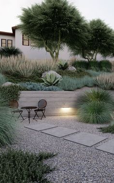 an outdoor patio area with gravel and plants