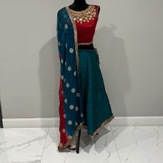 Indian Lehenga Choli With Heavily Embroidery On The Blouse Colors- Blue, Red, Gold Size- S Worn Once ( Excellent Condition) Transitional Blue Raw Silk Lehenga, Blue Raw Silk Choli With Gota Work, Fitted Blue Silk Sharara, Transitional Blue Silk Choli, Blue Silk Lehenga With Dori Work, Fitted Blue Traditional Wear With Gota Work, Indian Lehenga Choli, Indian Lehenga, Lehenga Choli