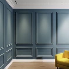 an empty room with blue walls and yellow chair