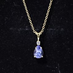 Product Details Experience classic and enduring sophistication with this Solitaire Pendant Necklace that features a Pear Shape Tanzanite gemstone set in 4 Prong Setting with a sparkling Diamond. Suspended from a delicate chain, this Fine Pendant Necklace will make you look out from the crowd. Product Information SKU SHP-PENDANT0821339952 Weight 2.00 gm (Approximate) TANZANITE INFORMATION No.of Stones 1 Pieces Total Weight 0.84 Carat (Approximate) Dimension(approx) Pear-5X7 mm-1 Pcs Color Blue Cut Brilliant Shape Pear Setting Type 4-Prong-Setting Quality Grade AAA DIAMOND INFORMATION No.of Stones 1 Pieces Total Weight 0.04 Carat (Approximate) Dimension(approx) Round-1.80X1.80 mm-1 Pcs Color HI Cut Brilliant Shape Round Setting Type 4-Prong-Setting Quality Grade SI View More Elegant Pear-shaped Gemstones For Formal Occasions, Classic Tanzanite Necklace With Brilliant Cut, Classic Tanzanite Necklace With Diamond Cut, Classic Tanzanite Necklaces With Diamond Cut, Yellow Gold Briolette Gemstones For Formal Occasions, Formal Yellow Gold Briolette Gemstones, Elegant Pear-shaped Gemstones For Anniversary, Classic Sapphire Drop Jewelry, Classic Tanzanite Jewelry With Diamond Accents