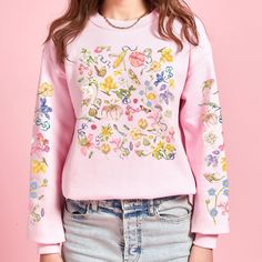 Embrace the timeless elegance of botanical art with our exclusive sweatshirt featuring a colorful flower design remixed from the masterpieces of Pierre-Joseph Redouté. Each petal delicately captures the essence of Redouté's renowned illustrations, blending classic artistry with contemporary style.  Each sweatshirt is carefully crafted to infuse a touch of nature into your wardrobe. The colorful wildflowers burst with life, creating a sense of warmth and joy. This sweatshirt is a perfect blend of style and comfort, making it an ideal addition to your wardrobe. Whether you're going for a walk in the park, a cozy evening in, or simply want to express your love for wildflowers, this sweatshirt has got you covered. Treat yourself or surprise a nature enthusiast in your life with this beautiful Printed Crew Neck Sweater For Spring, Embroidered Relaxed Fit Sweater For Spring, Botanical Style Cotton Sweatshirt For Spring, Pink Relaxed Fit Sweatshirt For Spring, Pink Floral Print Sweater For Spring, Spring Graphic Print Relaxed Sweater, Floral Embroidery Cotton Sweatshirt For Spring, Spring Sweatshirt With Relaxed Fit And Printed Details, Relaxed Fit Spring Sweatshirt