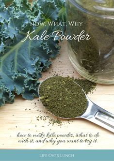 a spoon full of kale powder on top of a wooden table next to a green leafy plant