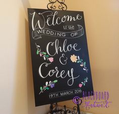 a chalkboard sign that says welcome to the wedding of chloe and cosey on it