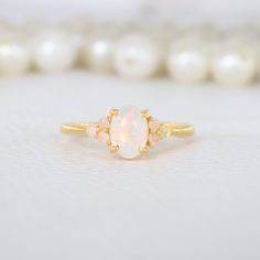 Oval Shape White Opal Ring 10K Solid Gold Engagement Ring Opal Cluster Bridal Ring October Birthstone Gold Jewelry Anniversary Gift For Wife Description: Main Stone - Opal ( Lab created ) Stone Size - 7 x 5 MM / 2 MM Stone color -Fire Opal Stone shape - Oval / Round Birthstone - October Finishing- Excellent feel free to contact me if you have any questions  Gemstone color may slightly vary from listed image due to the nature of all natural gemstone or different monitor settings TURNAROUND TIME Y White Opal Ring With Gemstone Accents As Gift, White Rings With Gemstone Accents, Gold Opal Birthstone Wedding Ring, Gold Wedding Birthstone Ring With Gemstone Accents, Dainty White Cluster Ring For Wedding, Heirloom Opal Ring With Gemstone Accents For Wedding, Gold Wedding Rings With Gemstone Accents, White Rings With Gemstone Accents For Gift, White Opal Crystal Ring For Wedding