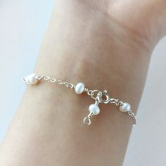 Delicate White Pearl Bracelet with Sterling Silver or 14K Gold Filled 💗 ✨ Dainty & Elegant. Simply beautiful bridal bracelet. A perfect gift & affordable treat for yourself. • Pearl size: 4 mm • Handmade with genuine white Freshwater Pearls. All metal parts are high-quality 925 Sterling Silver. It also can be made with 14K Gold-filled or Rose Gold-filled • Sterling Silver and 14K gold-filled are known for lasting quality. White proper care, this piece will last for decades and is considered a l White Pearl Bracelet, Sterling Silver Wire Wrap, Bridal Bracelet, Bracelet Sterling Silver, Dainty Bracelets, Cute Bracelets, Pinky Ring, Bridal Necklace, Pearl Size