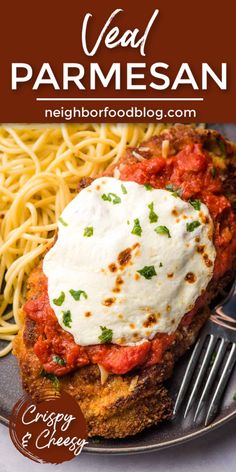 a plate with meat parmesan and spaghetti on it