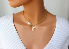 "OMG this is the cutest toggle front choker necklace ever! This lovely chain choker is made of 18k gold filled oval medium size long and short links measure 8x4mm. Toggle sits in front. The \"I Love U\" plaque, lock pendant and heart charm are all heavily 18k gold plated with crystals and pink enamel that make it stand out! I personally love this necklace! Model is wearing a 15\" length. This necklace comes in many lengths please choose your desired length. Best to measure your neck if you not s Cute Gold Choker Jewelry, Gold Heart Choker, Lock Charm Necklace, 14kt Gold Jewelry, Necklace Model, Clean Sterling Silver, Lock Pendant, Gold Chain Choker, Pink Charm