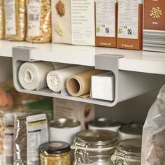 the shelves are filled with different types of food