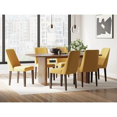 a dining room table with yellow chairs around it