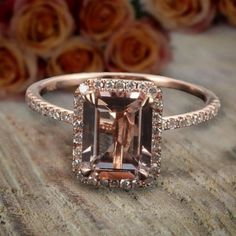 A perfect handmade Limited Time Sale 1.75 Carat 7x5mm Emerald Cut Morganite and Diamond Moissanite Halo Engagement Ring with 18k Gold Plating in 925 Silver with Rose Gold Plating. Peach Pink Morganite is true of character, the vibrant hues reminiscent of the radiant sunset.Inspired by the true harmony of love, the delicate design of the Engagement Ring in 925 Silver with Rose Gold Plating has been enriched with glittering moissanite Diamond Moissanite for added delight and brilliance. A beautifu Morganite Diamond Engagement Ring, Engagement Ring Mountings, Pink Emerald, Moissanite Engagement Ring Halo, Morganite Diamond, Ringe Gold, Pink Morganite, Halo Diamond Engagement Ring, Peach Pink