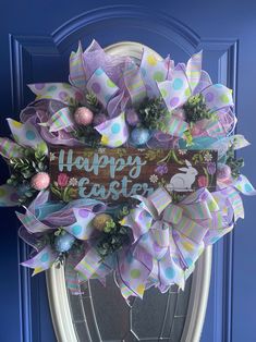 a happy easter wreath hanging on the front door